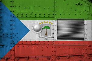 Equatorial Guinea flag depicted on side part of military armored tank closeup. Army forces conceptual background photo