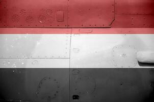 Yemen flag depicted on side part of military armored helicopter closeup. Army forces aircraft conceptual background photo