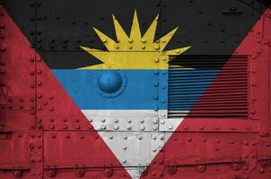 Antigua and Barbuda flag depicted on side part of military armored tank closeup. Army forces conceptual background photo