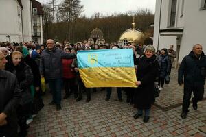 TERNOPIL, UKRAINE - APRIL 2, 2023 People with flag during mission in complex of Ukrainian Jerusalem in the Mari spiritual center of Zarvanytsia In the Terebovlya district of the Ternopil photo