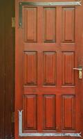 Texture of red entrance door to residential building photo