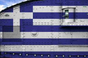 Greece flag depicted on side part of military armored tank closeup. Army forces conceptual background photo