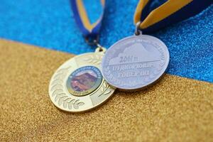 KYIV, UKRAINE - MAY 4, 2022 Medal for the person who conquered Mount Hoverla photo