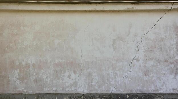 Wall fragment with scratches and cracks background texture photo