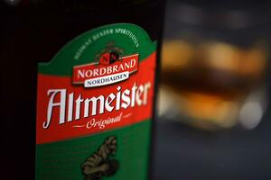 KHARKOV, UKRAINE - DECEMBER 3, 2020 Altmeister original liqueur bottle on dark black background. Elite alcohol photo