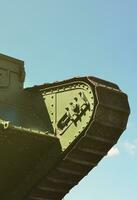 Caterpillars of the green British tank of the Russian Army Wrangel in Kharkov against the blue sky photo