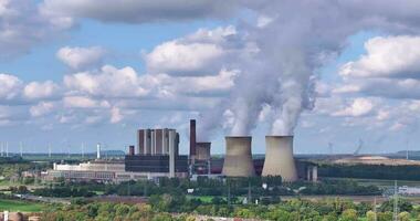 Drone movie of a coal-fired power station with smoking chimneys video
