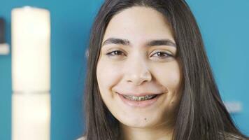 Happy young woman smiling. Dental braces. video