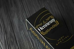 KYIV, UKRAINE - MAY 4, 2022 Hennessy Very Special original alcohol bottle on black wooden table photo