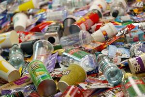 KHARKOV, UKRAINE - AUGUST 10, 2021 Big pile of various wrappings and empty disposable packages and cups from famous branded food production photo