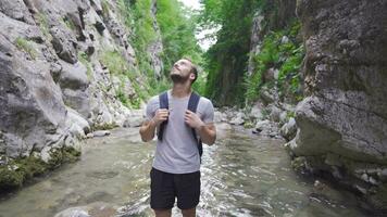 Young man in the water in the valley. video