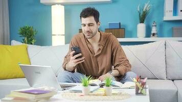 Young man reading good news. video