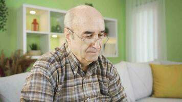 Close-up portrait of Positive Thoughtful old man. video