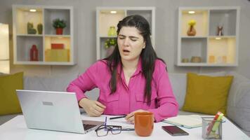 Home office worker woman has lower back pain. video