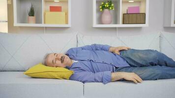 The old man lying on the sofa, serene and peaceful. video