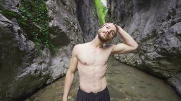 Sporty young man doing neck exercise in nature. video