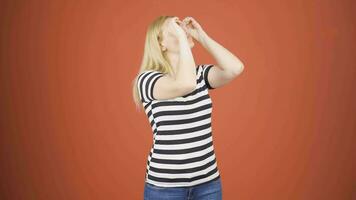 Woman with binoculars looking away. video