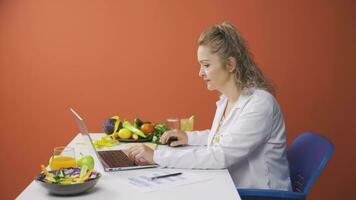 Dietitian preparing diet plan on laptop. video