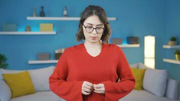 Guilty young woman looking innocently at camera. video