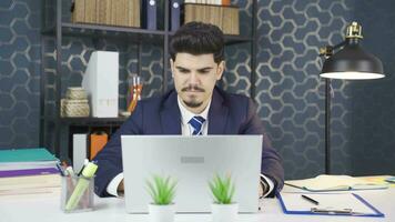 Portrait of young businessman working in the office. video