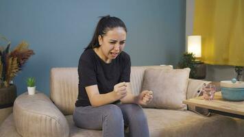 Woman having a nervous breakdown at home is shouting. video