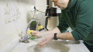 Water gushing from a broken faucet. The landlord tries to fix it. video