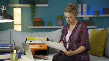 Home office worker woman examining, analyzing documents. video