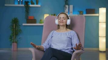 Happy woman listening to music with headphones. video