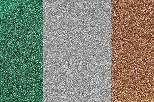 Ireland flag depicted on many small shiny sequins. Colorful festival background for party photo