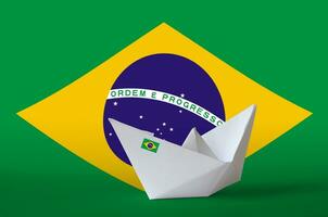 Brazil flag depicted on paper origami ship closeup. Handmade arts concept photo