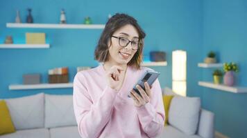 Confused young woman reading good news. video