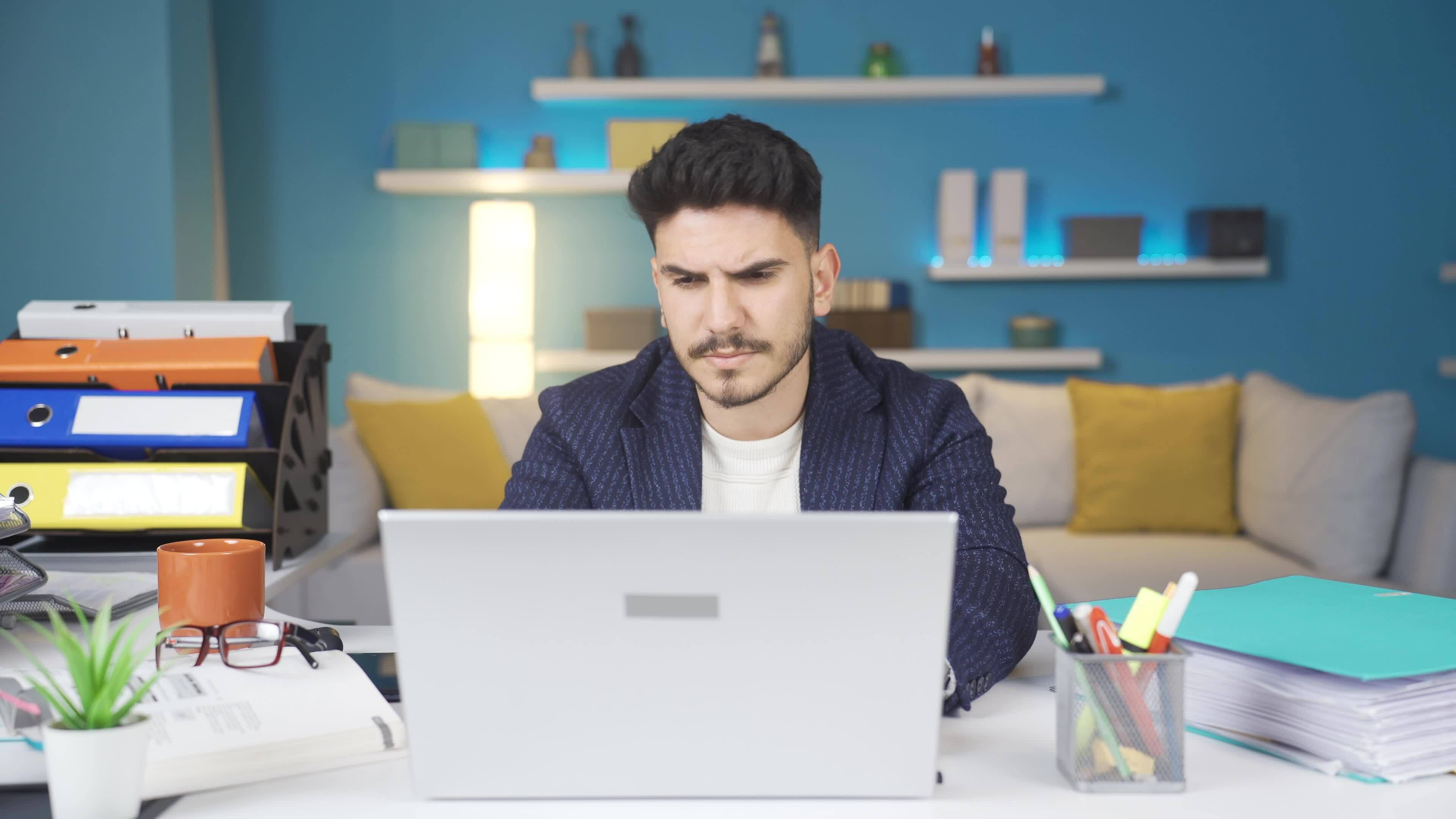 The man whose neck hurts from looking at the computer. 33549118 Stock