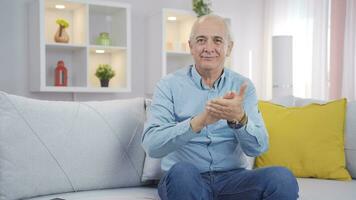 Man giving greeting and applause to camera. video