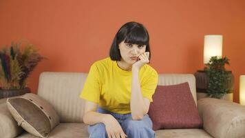 Woman looking depressed at camera. video