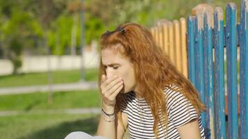 Woman coughing outdoors, lung problem. video