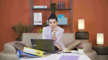 Home office worker woman thinking looking at camera. video