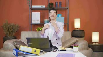 Home office worker woman looks at camera with happy and smiling face. video