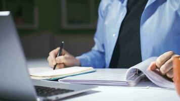 Home office worker examining files. video