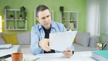 Man looking at documents getting angry and stressed. video