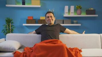 The man lying down and resting relaxes and unwinds. video