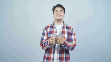 Man counting money looking at camera. video