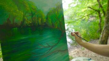 The painter draws a picture about nature. video