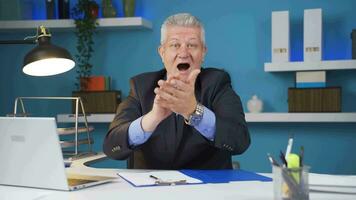 Excited businessman clapping at camera. video