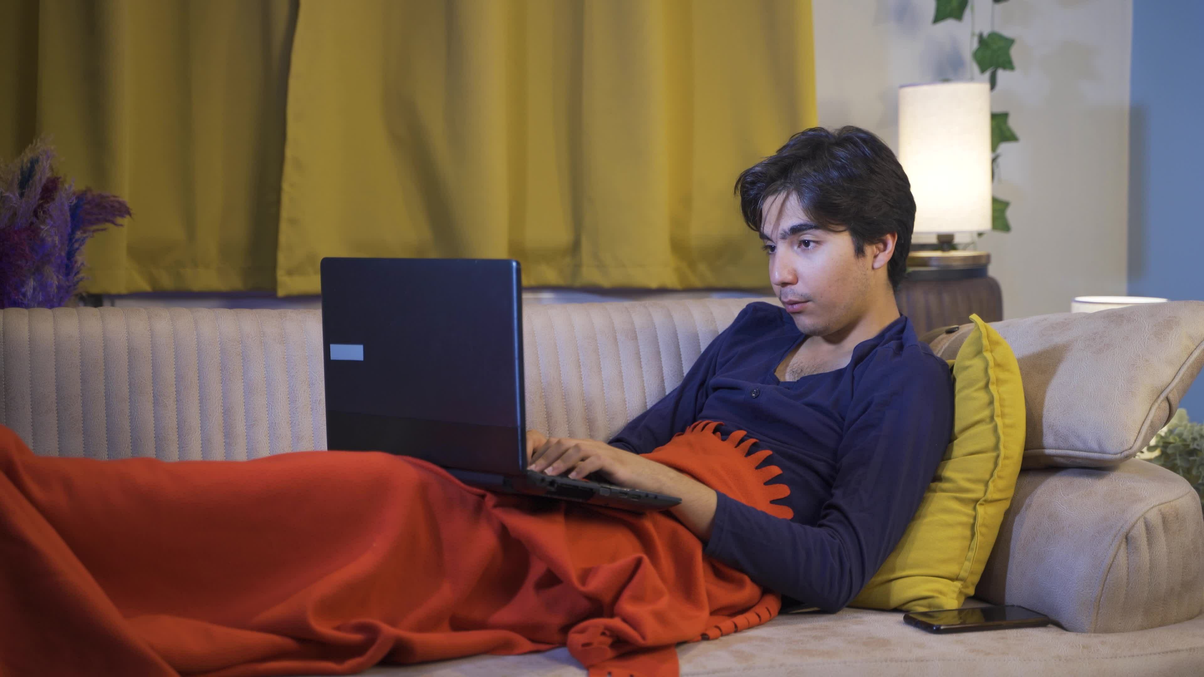 Happy young woman using laptop lying down. 33550906 Stock Video at Vecteezy