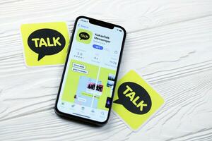 KHARKOV, UKRAINE - MARCH 5, 2021 KakaoTalk Messenger icon and application from App store on iPhone 12 pro display screen on white table photo