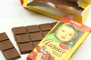 KHARKIV, UKRAINE - JANUARY 27, 2021 Alyonka chocolate square bars - product from Red October chocolate factory photo