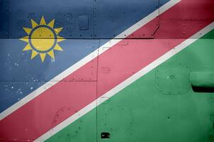 Namibia flag depicted on side part of military armored helicopter closeup. Army forces aircraft conceptual background photo