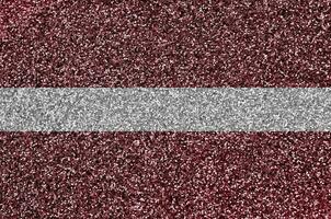 Latvia flag depicted on many small shiny sequins. Colorful festival background for party photo