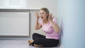 Woman having a nervous breakdown at home is shouting. video