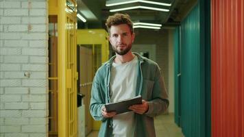 Portrait Stylish European businessman stands in a multicolored corridor.Different Races,Diverse People,Creative Team,Business Partners video